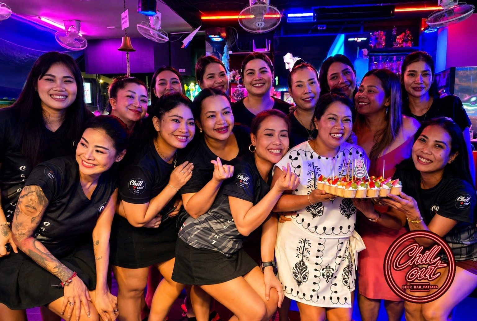 Chill Out Bar staff with drinks near pool table